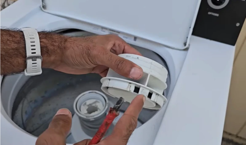 Maytag washer repair California — WasherDoctor technician servicing Maytag top-load